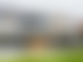 Modern house extension with render, aluminium and cedar.