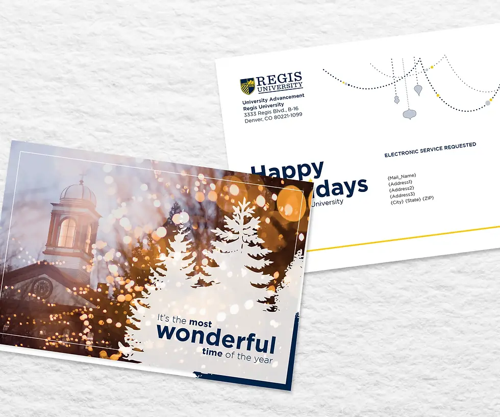 A holiday card and its envelope from Regis University on a light textured background.