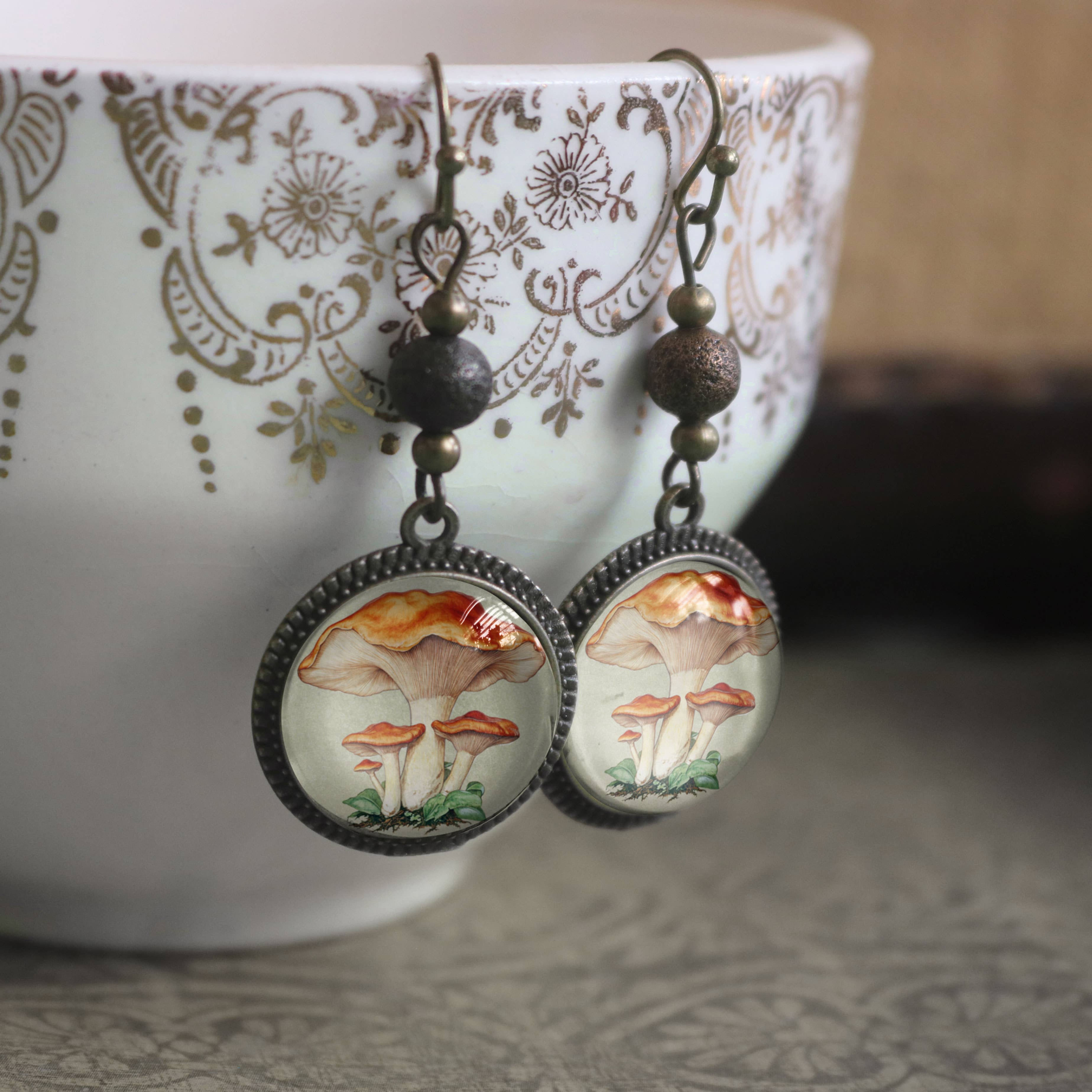 Earrings with images of chantarelle mushrooms.