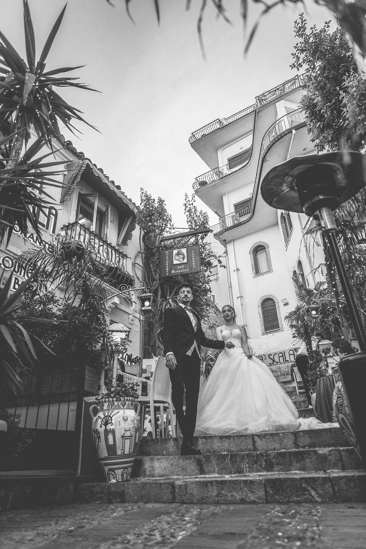 Taormina wedding photographer – couple walking in the old town 17