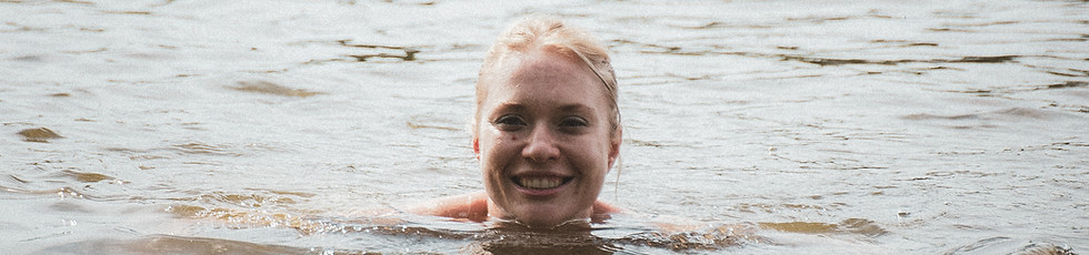 Woman swimming at The Hideout creative camp for grown-ups