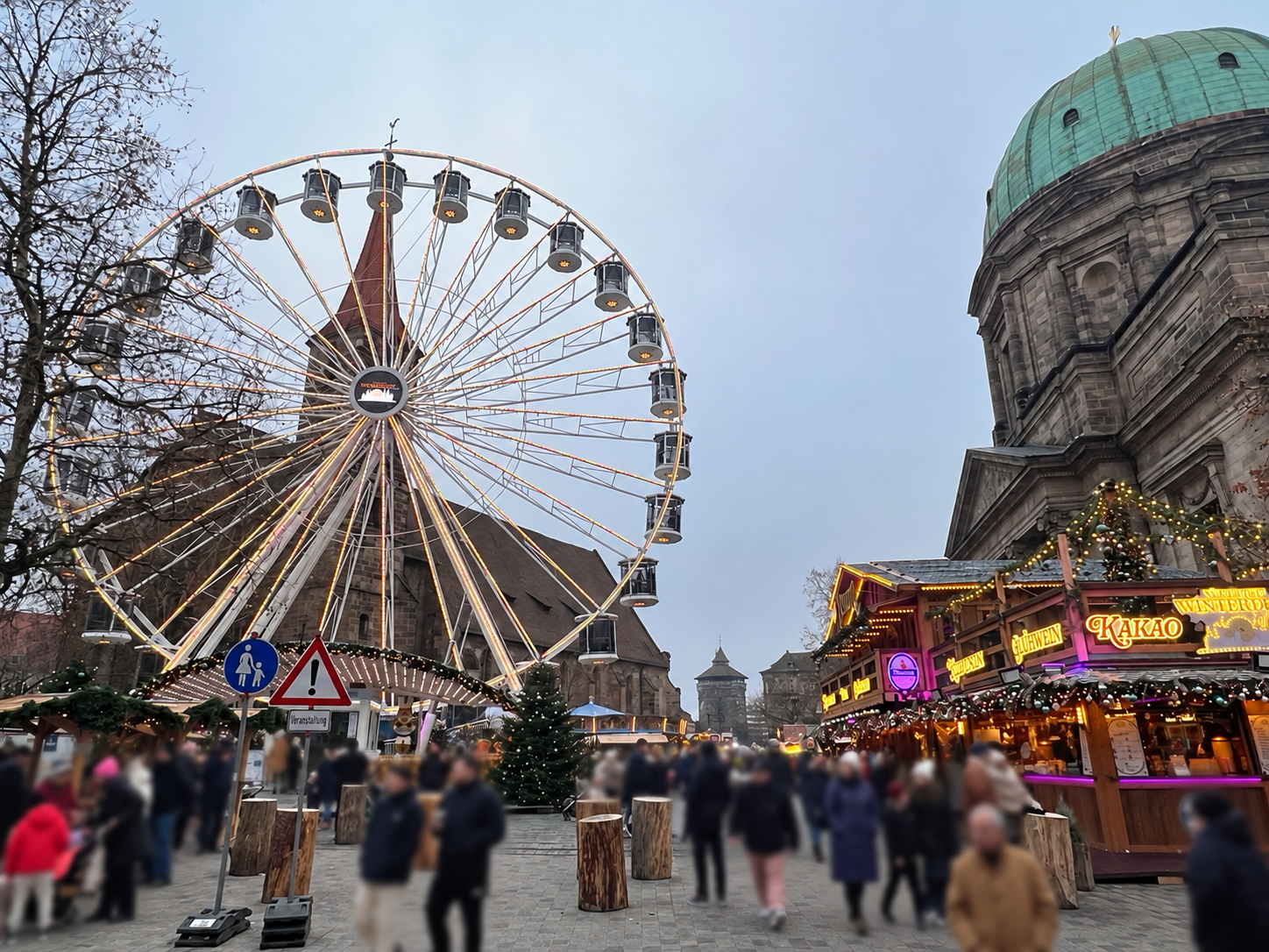 Ferris wheel and Christmas market stalls at Jakobsplatz in Nuremberg