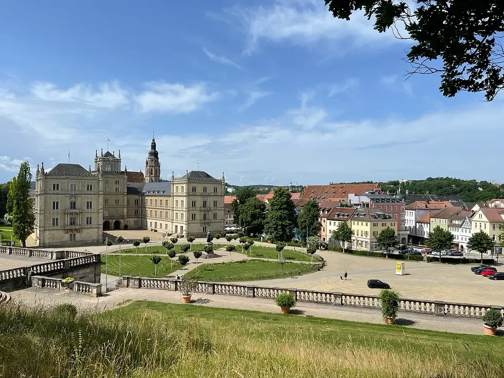 View from the Hofgarten across Ehrenburg Palace, its formal gardens and Coburg’s red-roofed old town.