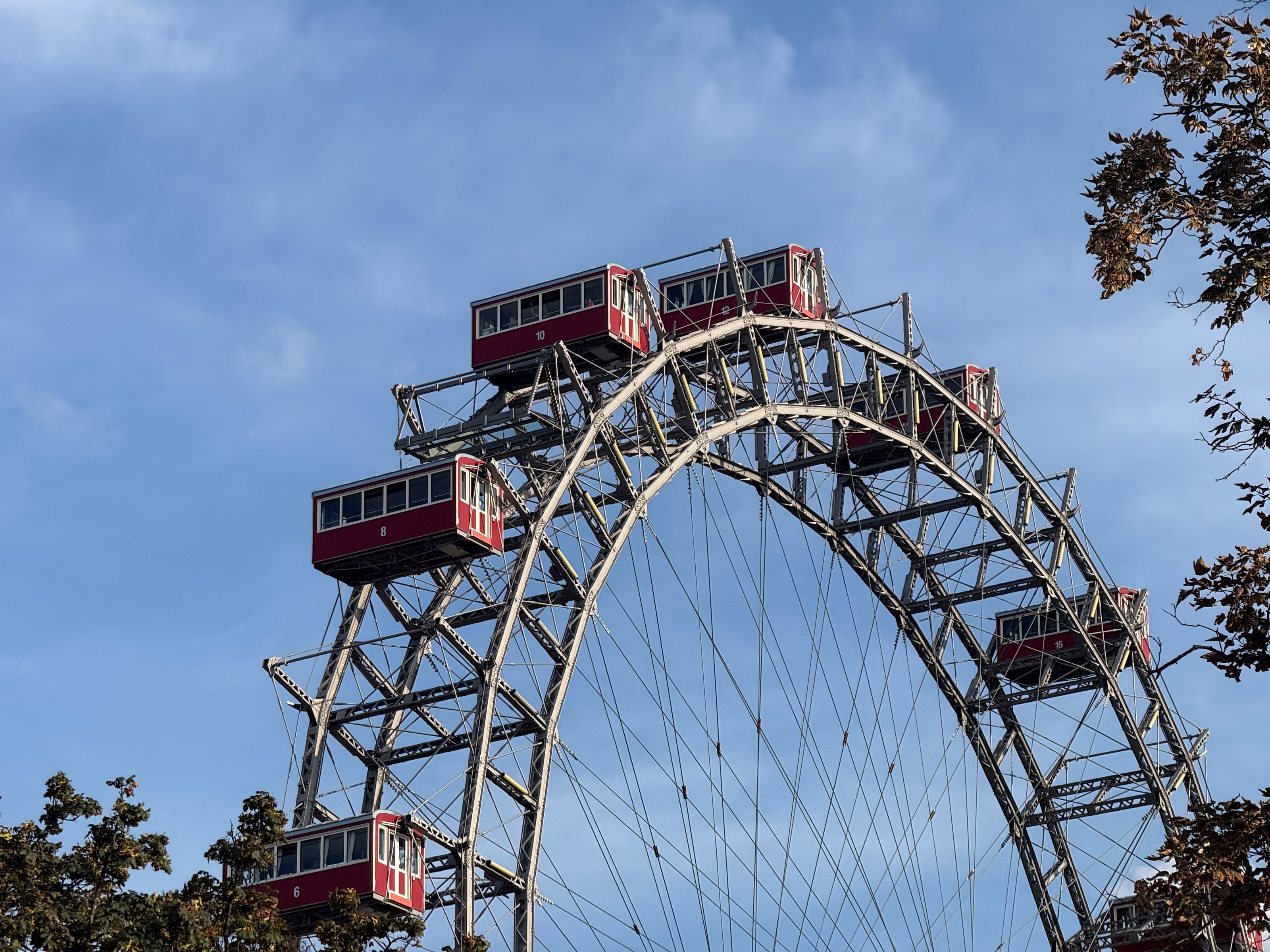 Red passenger cabins on Vienna’s historic Giant Ferris Wheel at the Prater.