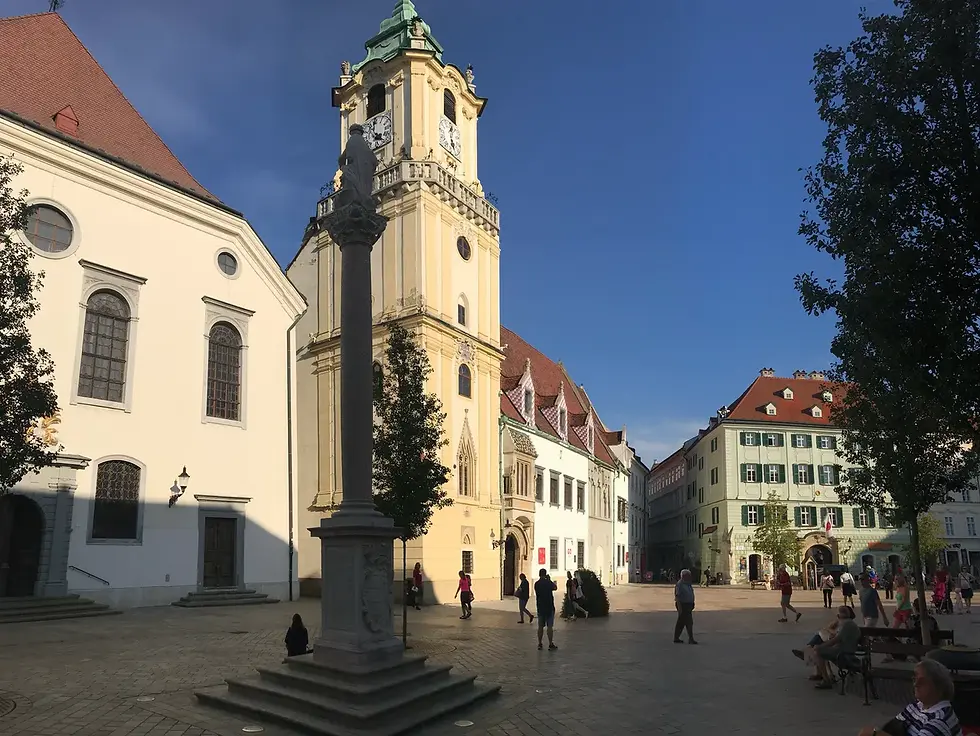 Bratislava’s Old Town Hall tower and Marian Column in historic Franciscan Square