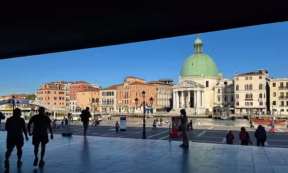 The Grand Canal and green-domed San Simeone Piccolo church seen from Venice’s Santa Lucia station.