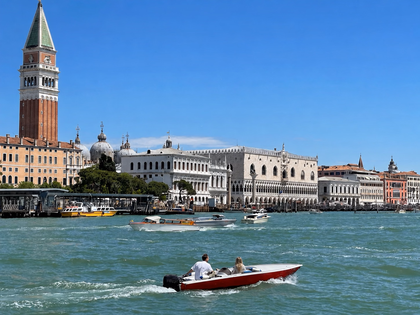 Boats crossing the Venetian Lagoon near St. Mark’s waterfront