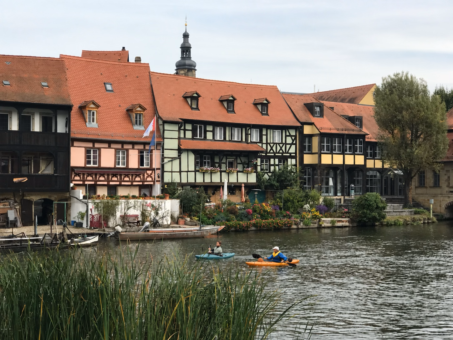 Bamberg's Old Town Hall spanning the Regnitz River between stone bridges