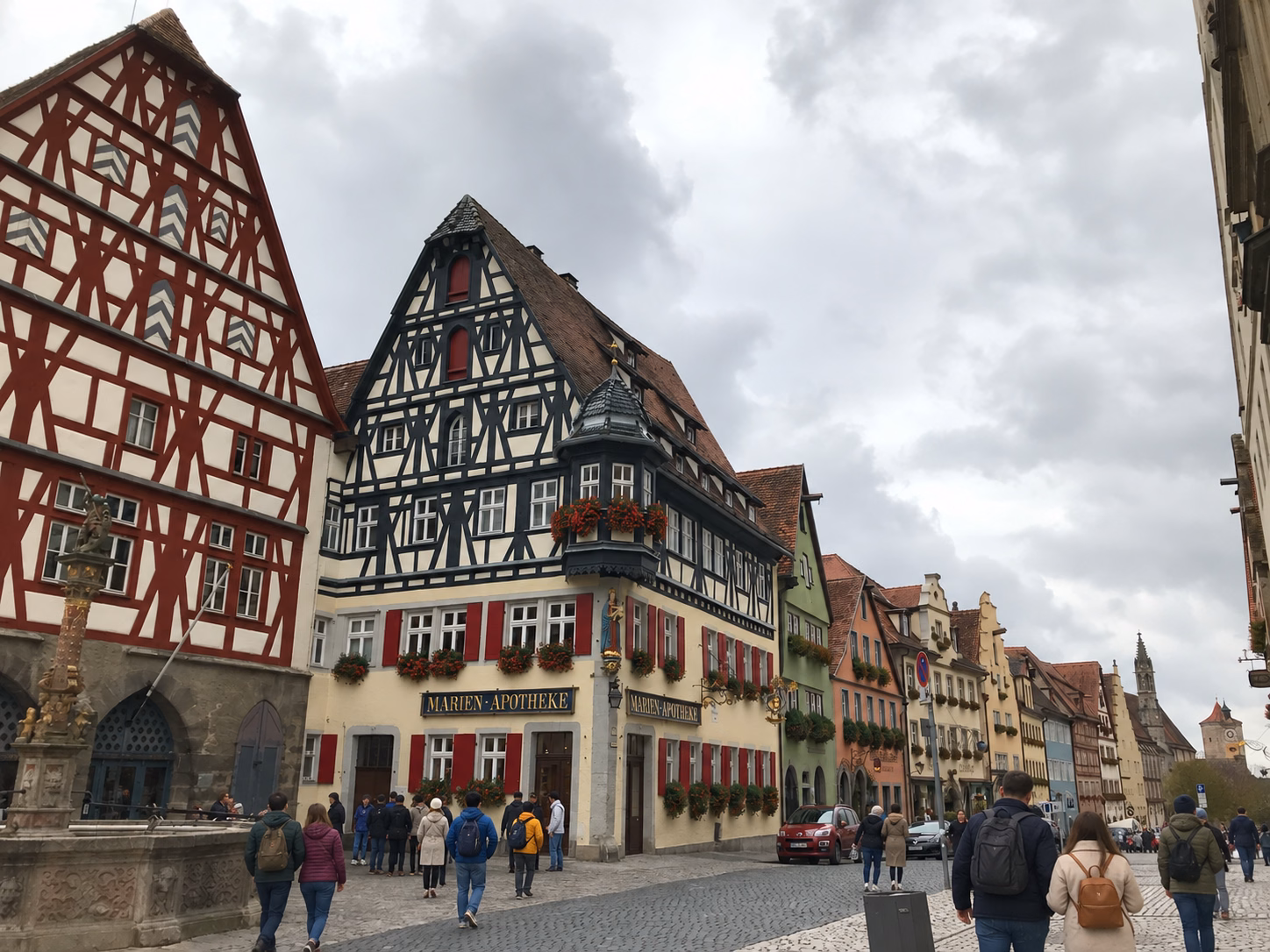 Timber-framed houses and a stone tower at Rothenburg's Plönlein junction