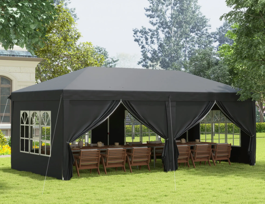 Wide angle view of a stylish marquee set up in a garden