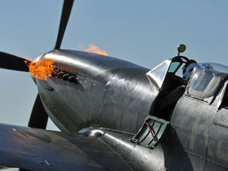 Spitfire nose & propeller emitting flames.