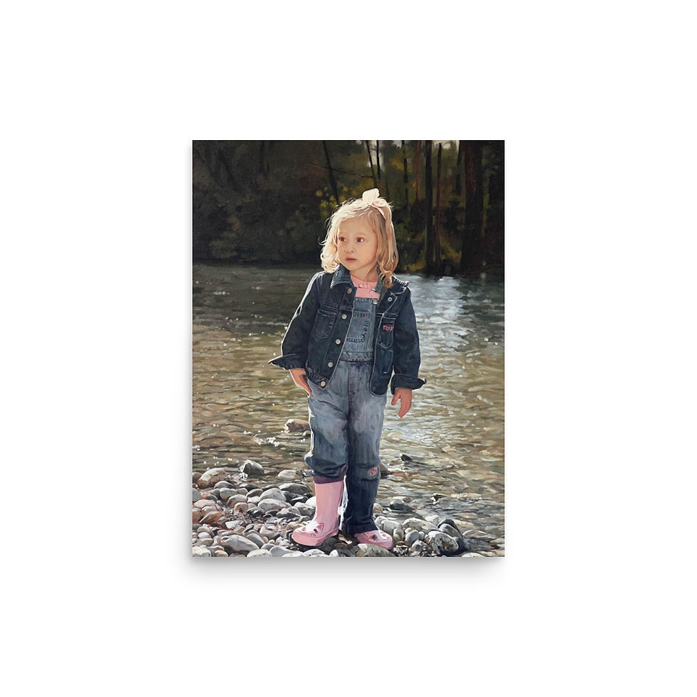 Young girl in denim jacket, overalls, pink boots by rocky stream.