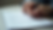 Close-up view of a person writing notes on a business plan template