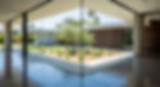 Architectural glass. A frameless glass corner window where two panes meet at a perfect 90-degree angle with clear silicone. No mullion. the home is a luxury modern LA home where the floor interior is a polished concrete floor slabs
