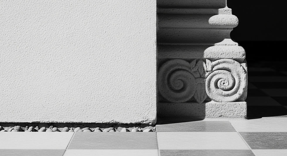 Abstract architectural photography. Black and white. A macro close-up of a seamless, bone-white plaster wall meeting a floor with a 'fry reglet' shadow reveal (Monolithic). Contrast this with a secondary element in the background: a complex, physically carved stone corbel (Ornamental). Sharp focus on the negative space of the reveal. High contrast.