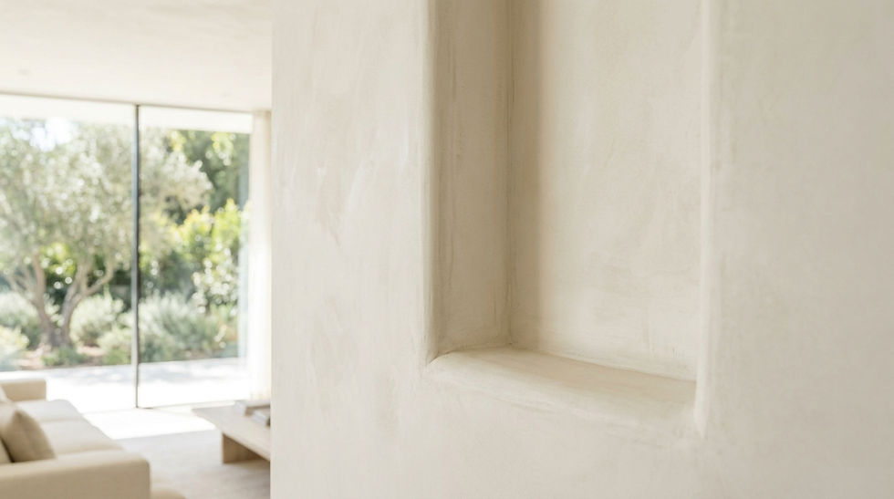 A soft, tone-on-tone plaster wall reveal with very subtle, feathered shadows.