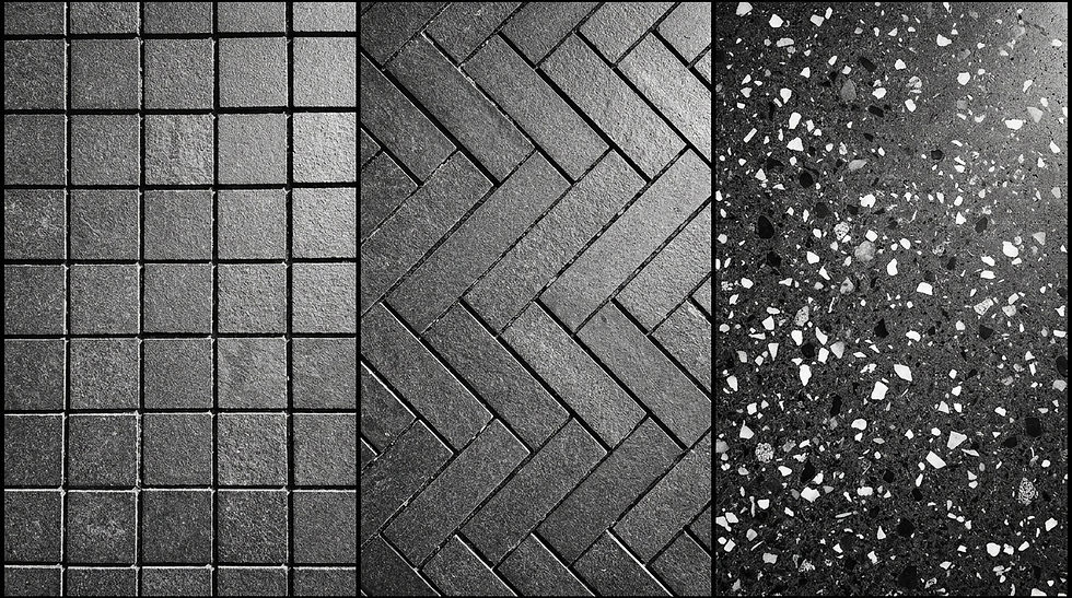 Abstract architectural photography. High contrast black and white. A top-down split-composition of three distinct flooring layouts using the exact same stone material. Left: perfectly aligned square tiles in a strict stacked-bond grid (Grid-Based). Center: rectangular planks laid in a sharp, driving herringbone pattern (Directional). Right: A seamless terrazzo pour with a totally random distribution of aggregate stones (Random). The lighting rakes across the surfaces to highlight the joint lines and arrangement."