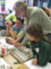 volunteer teaching students about geology