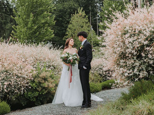Bride and groom gaze lovingly into each other’s eyes as they walk along a garden path at Liljebeck Farms in Woodinville, Washington.