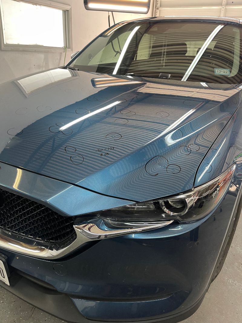 Before paintless dent repair, vehicle with hail damage
