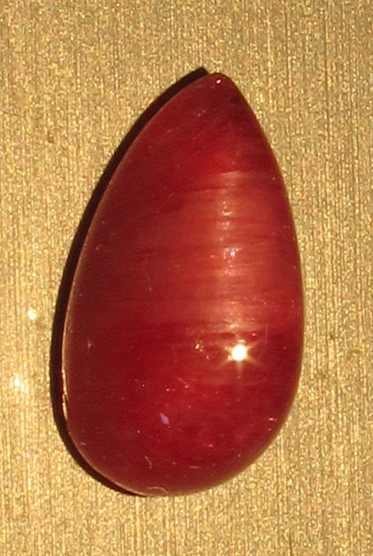 Thumbnail: Red Emerald Catseye 1.13 carat Pear Shaped Gem Cabochon