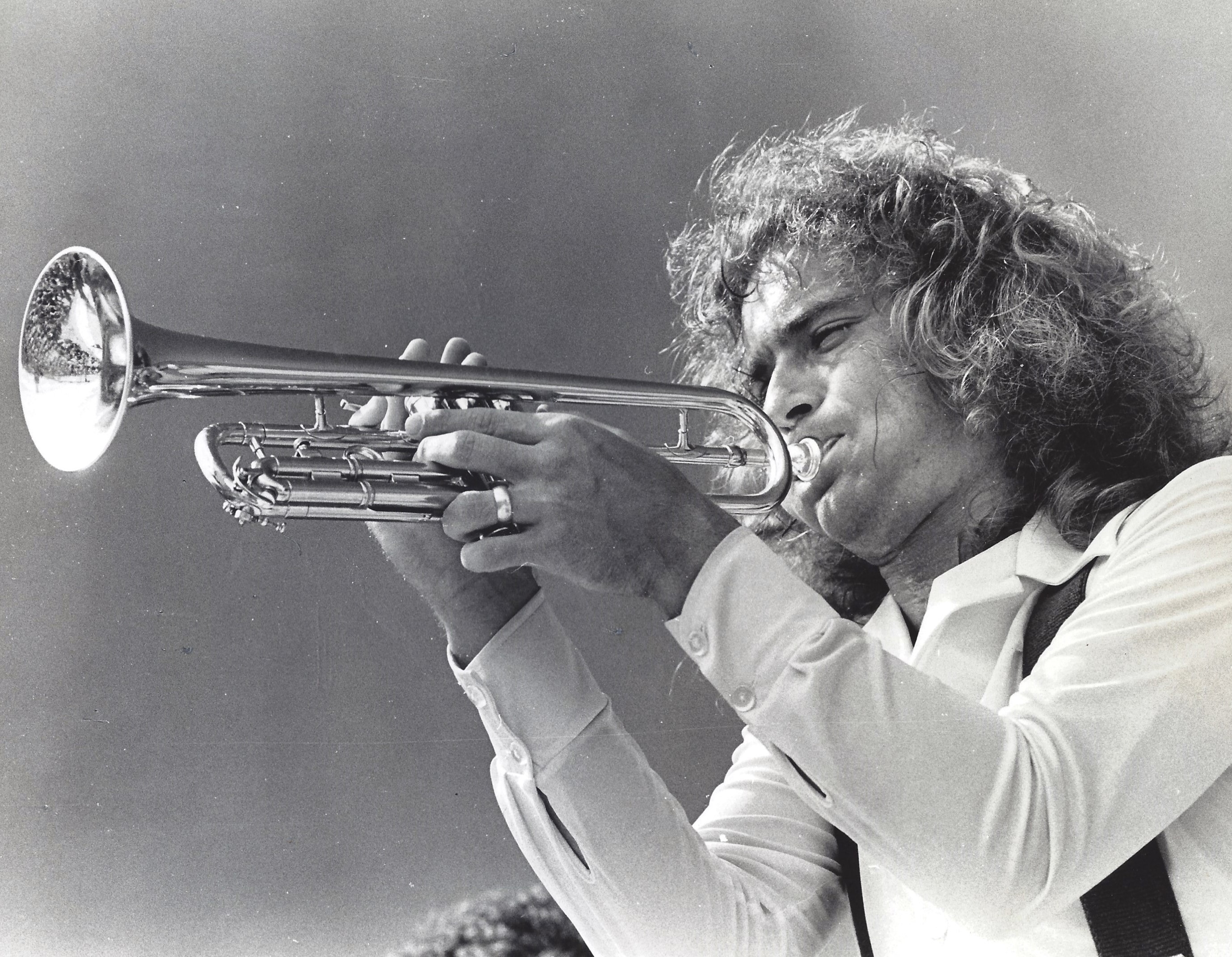 Billy Luxon playing trumpet during his years with Exile