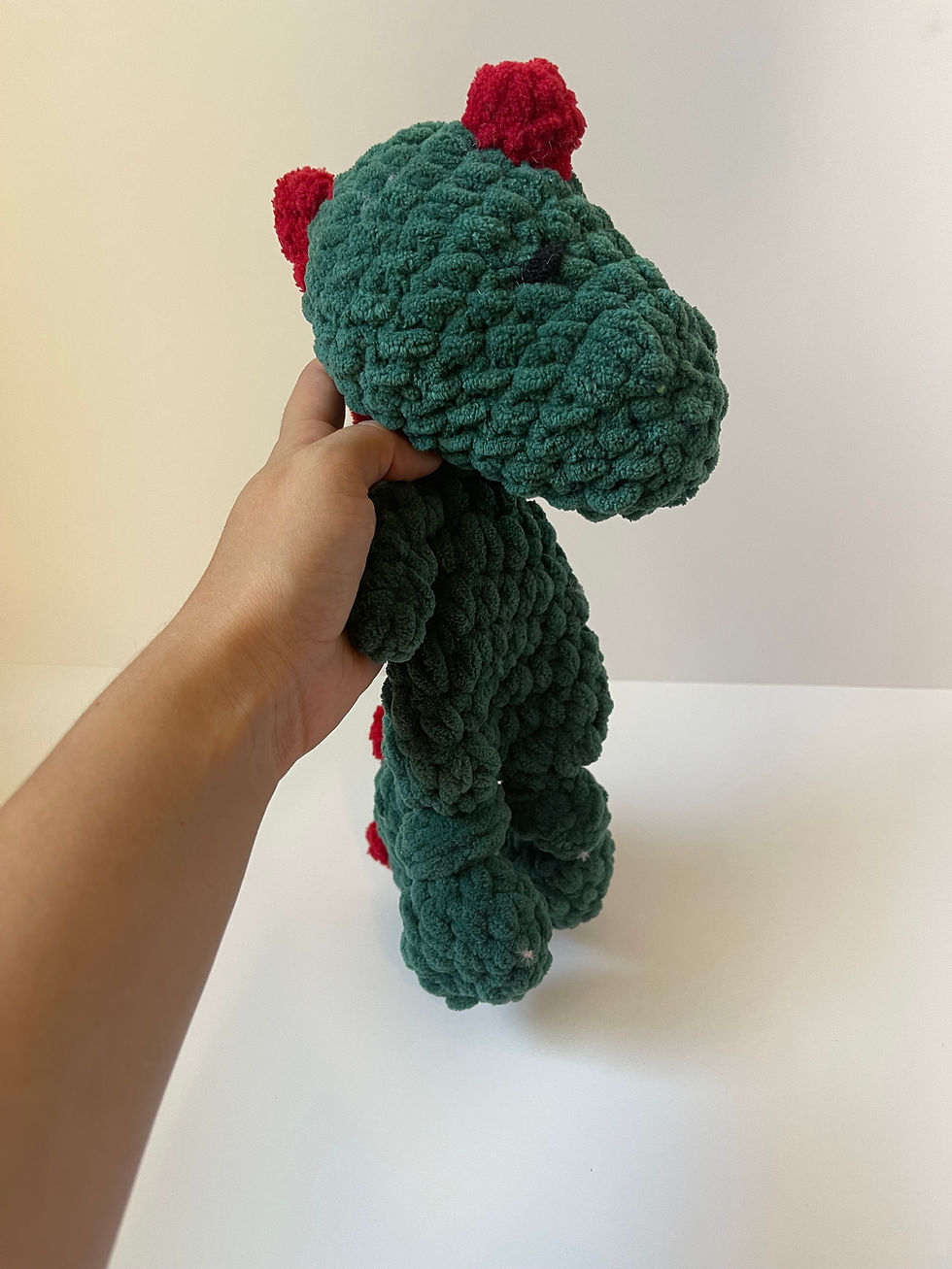Thumbnail: crochet dinosaur lovey green and red