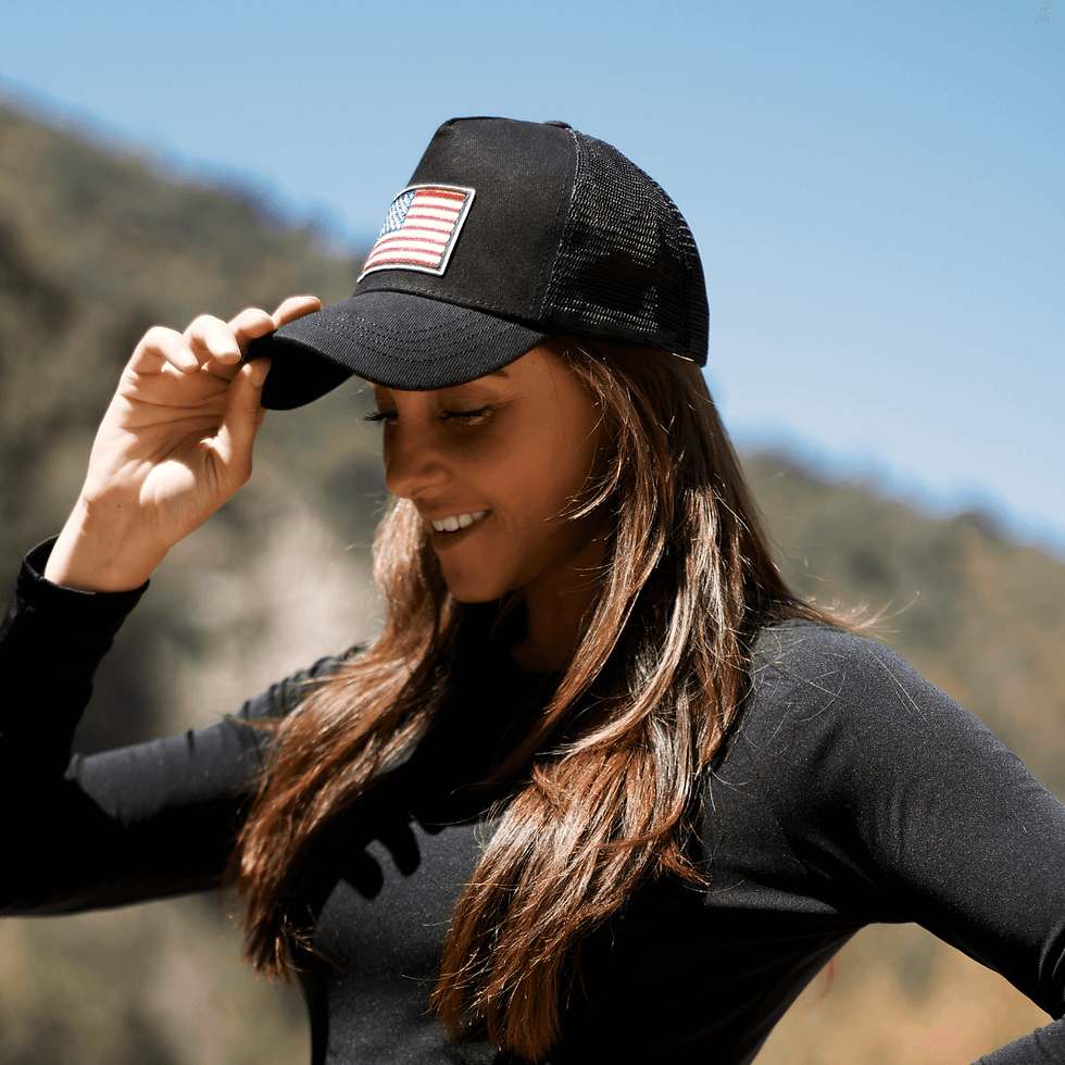 Thumbnail: American flag trucker hat with adjustable strap and breathable mesh back.