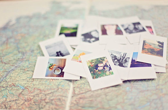 photographs of memories on top of a map