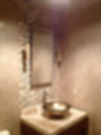 Powder room with metallic plaster
