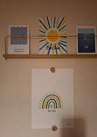Shelf with art pieces, sun, rainbow, text. Les Créations de Sophie Mignon.