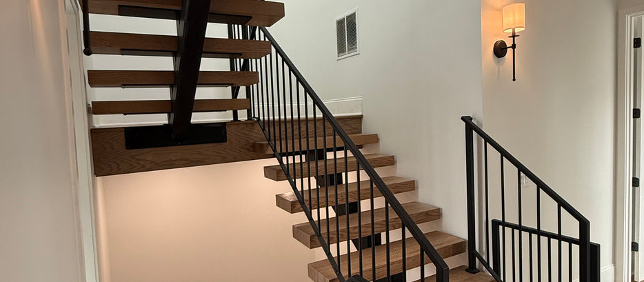 Modern floating staircase designed to meet residential building code requirements