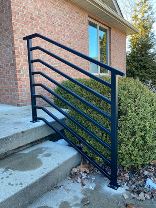 Exterior steel railing system installed on residential concrete steps