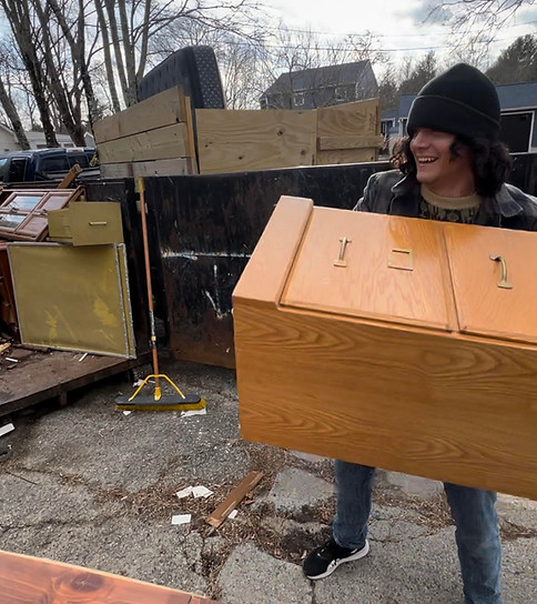 coastal junk removal solutions lifting heavy furniture during a junk removal home cleanout in Fall River, Massachusetts