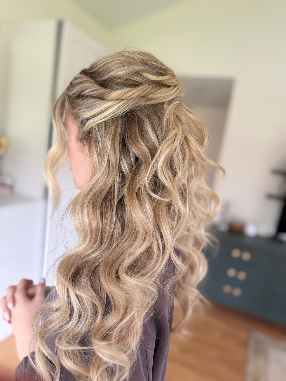 Luxury bridal styling with soft curls and radiant complexion