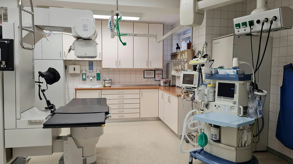 Close-up view of a cleaning professional disinfecting a GP surgery consultation room
