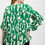 Thumbnail: Geometric print ruffled bell sleeve woven top