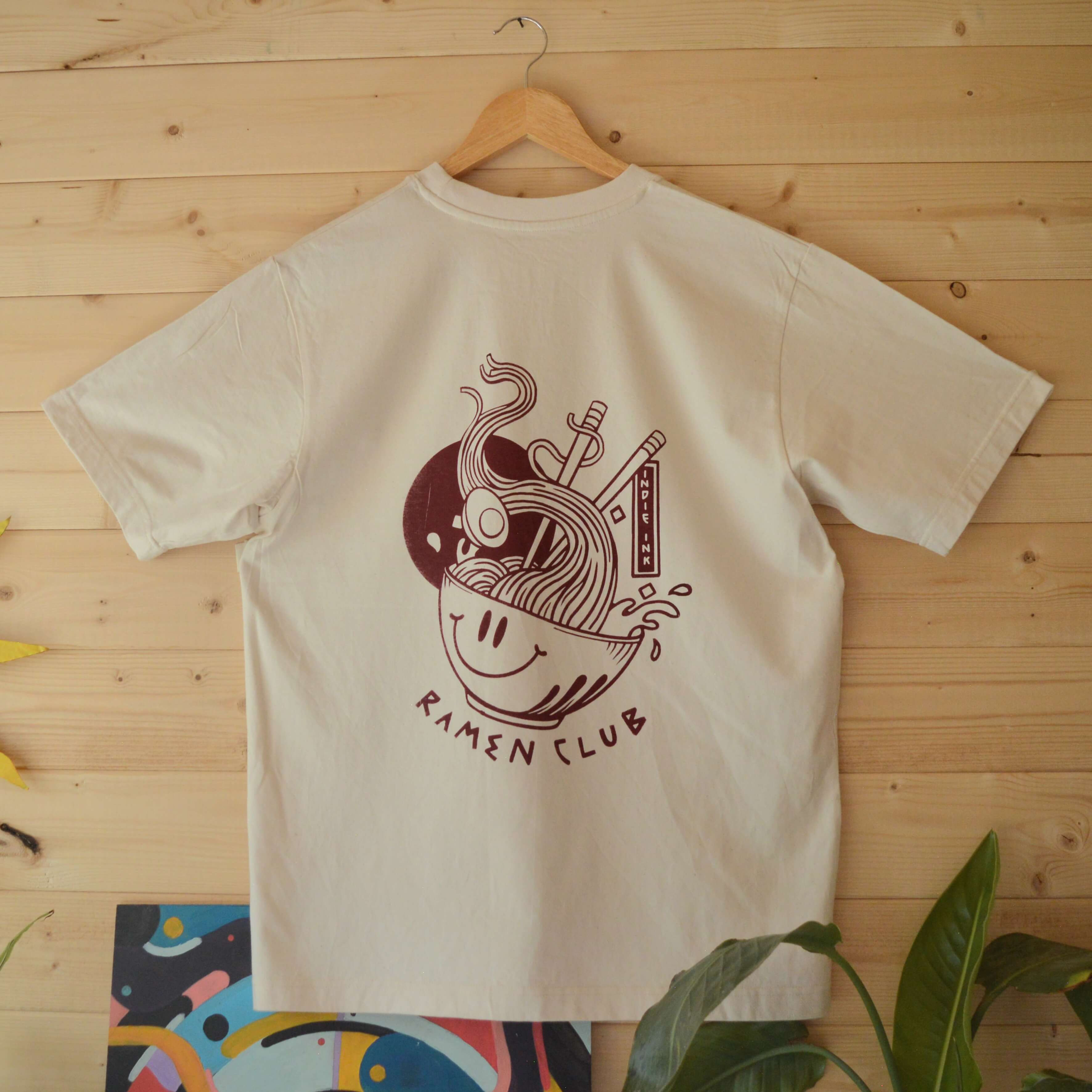 Off white graphic t-shirt with a maroon Japanese style illustration