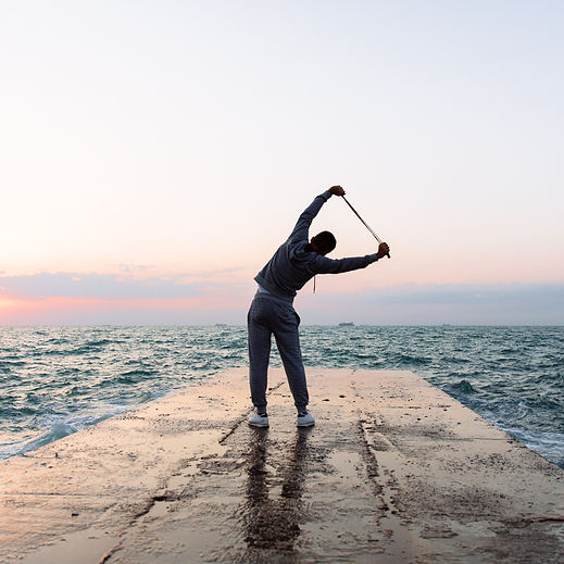 full-length-photo-sportsman-practicing-exercises-stretching-with-skipping-rope.jpeg