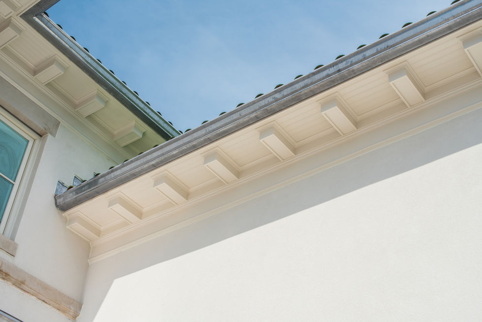 Roofline and eaves against a clear blue sky.