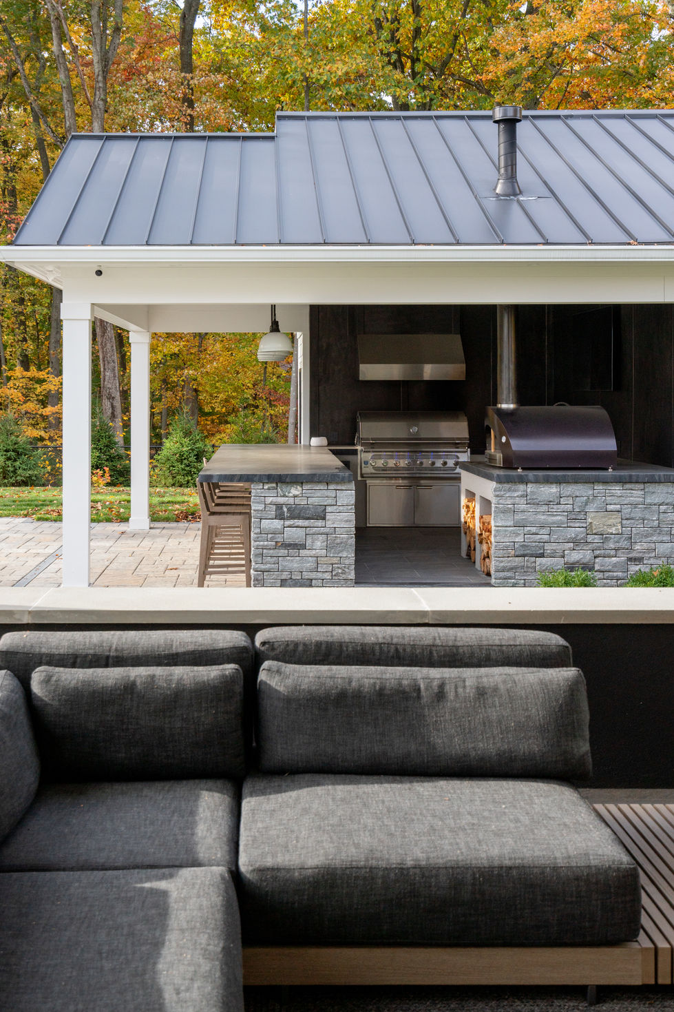 Backyard pool-side kitchen Allendale home