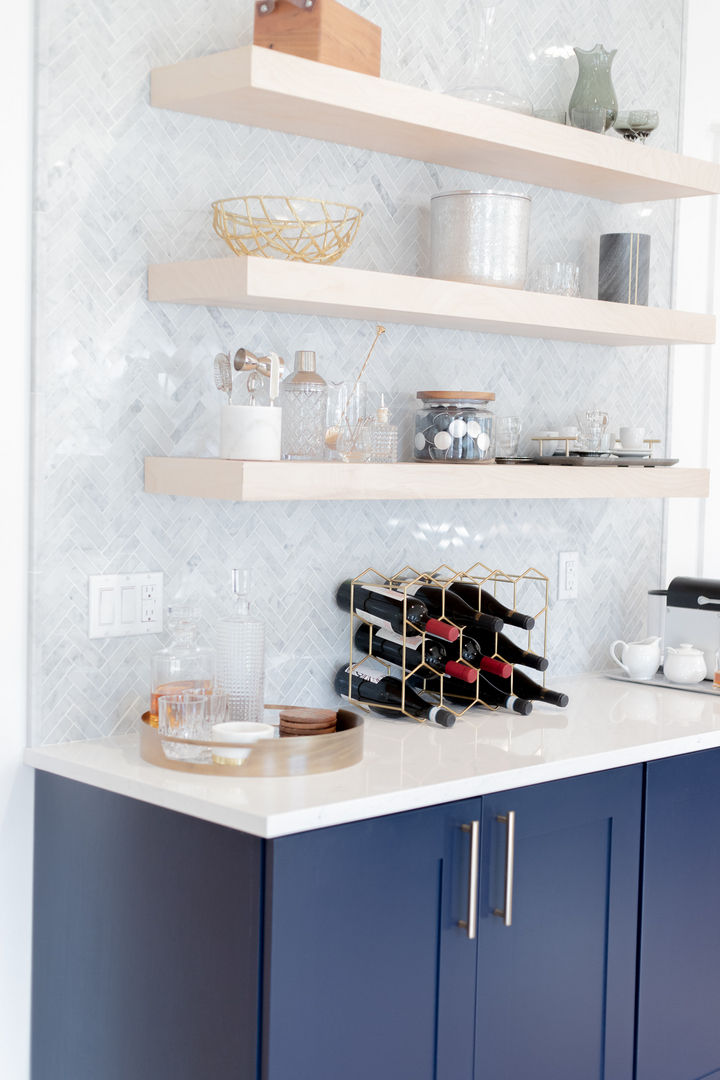 Modern kitchen shelves with wine rack and decor.