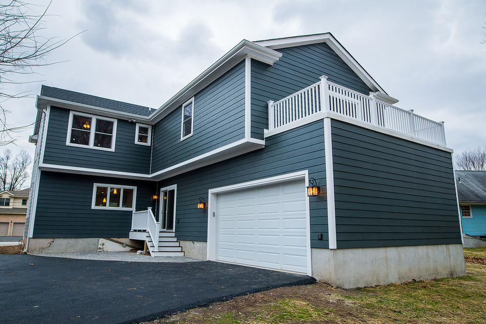 Back view of a fully renovated Ridgewood home, showcasing the updated exterior