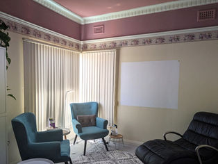 Two comfortable blue chairs and a black relaxation chair at Bunbury Hypnotherapy's consulting rooms. A relaxed place to get help switching off racing thoughts at night.