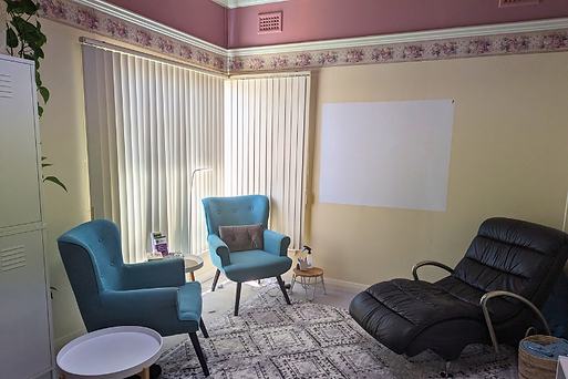 Consulting room with blue-green chairs