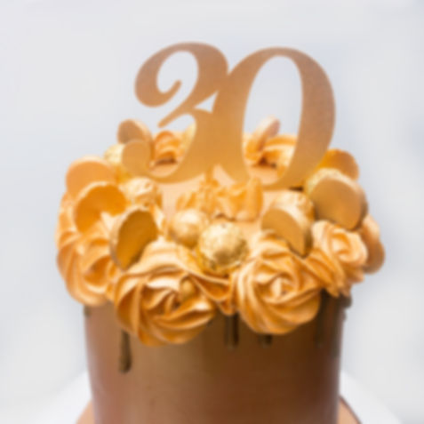 Gold Cake with Chocolate Drip and Chocolates