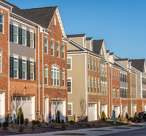 American town home neighborhood street with colorful brick and vinyl facade multi-family d