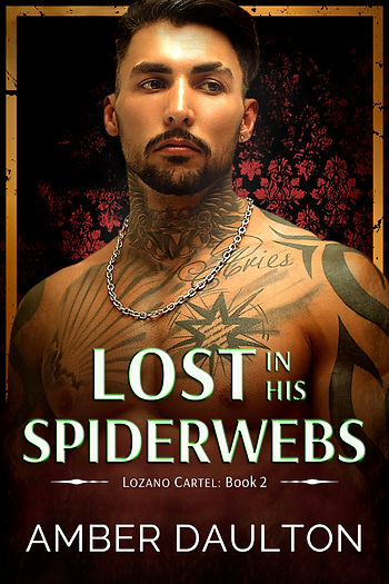 Tattooed man with a chain necklace against a dark floral backdrop. Text: "Lost in His Spiderwebs," "Lozano Cartel: Book 2," "Amber Daulton."