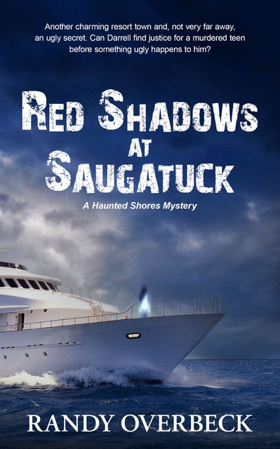 A yacht on stormy seas with dark clouds overhead. Text: "Red Shadows at Saugatuck," "A Haunted Shores Mystery," "Randy Overbeck."