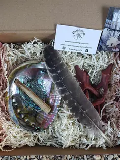 open box with 6-7" Abalone shell, Palo Santo Stick, turkey feather and a one piece wooden tripod stand